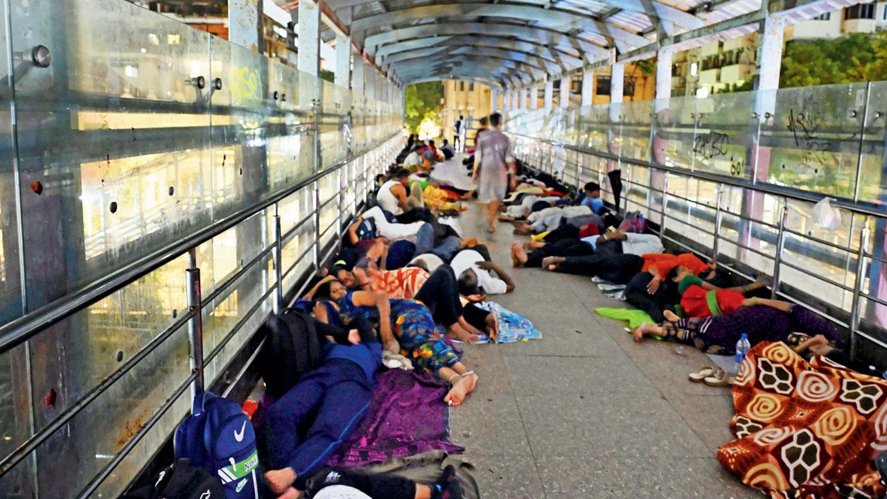 Candidates along with their parents sleep on railway FOB