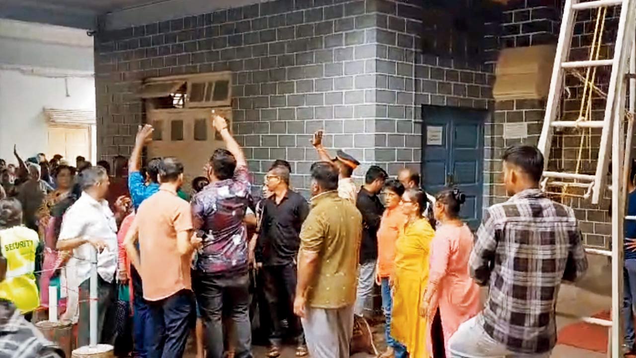   Former stallholders protest amid the announcement of lottery winners at the Basilica of Our Lady of the Mount on Monday