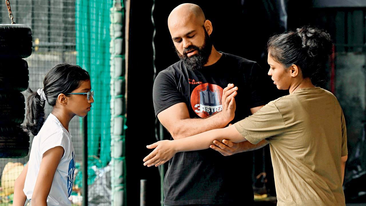 Pai and Shravani Lad learn a technique from Krav Maga practitioner Anurag Rane at his class in Borlivli. Pics/Satej Shinde