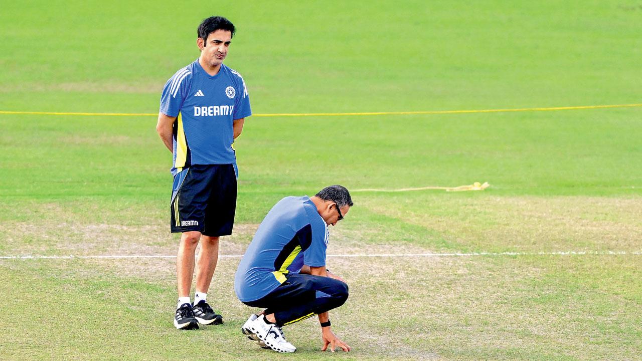 Gautam Gambhir and Ajit Agarkar inspect the pitch in Colombo on July 31. Pic/AFP