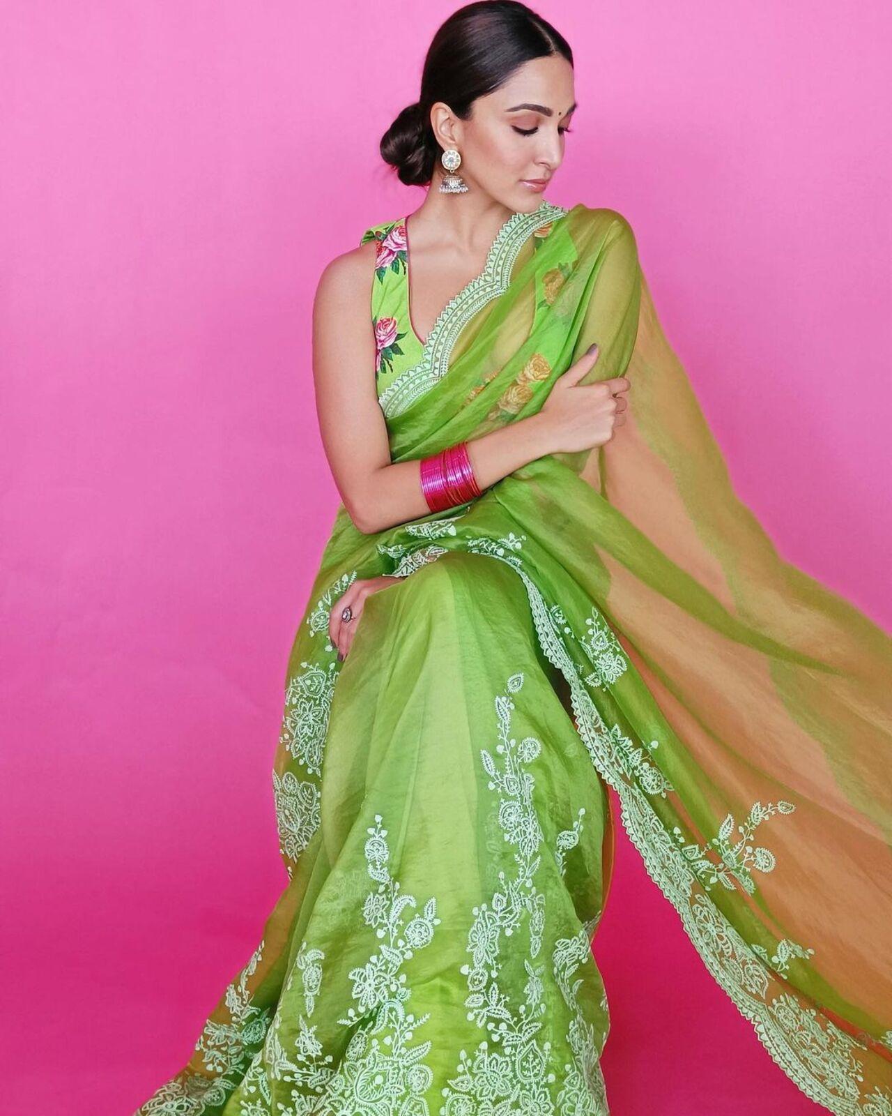 Kiara wore beautiful pink bangles that matched her blouse print while establishing a perfect contrast with her saree.