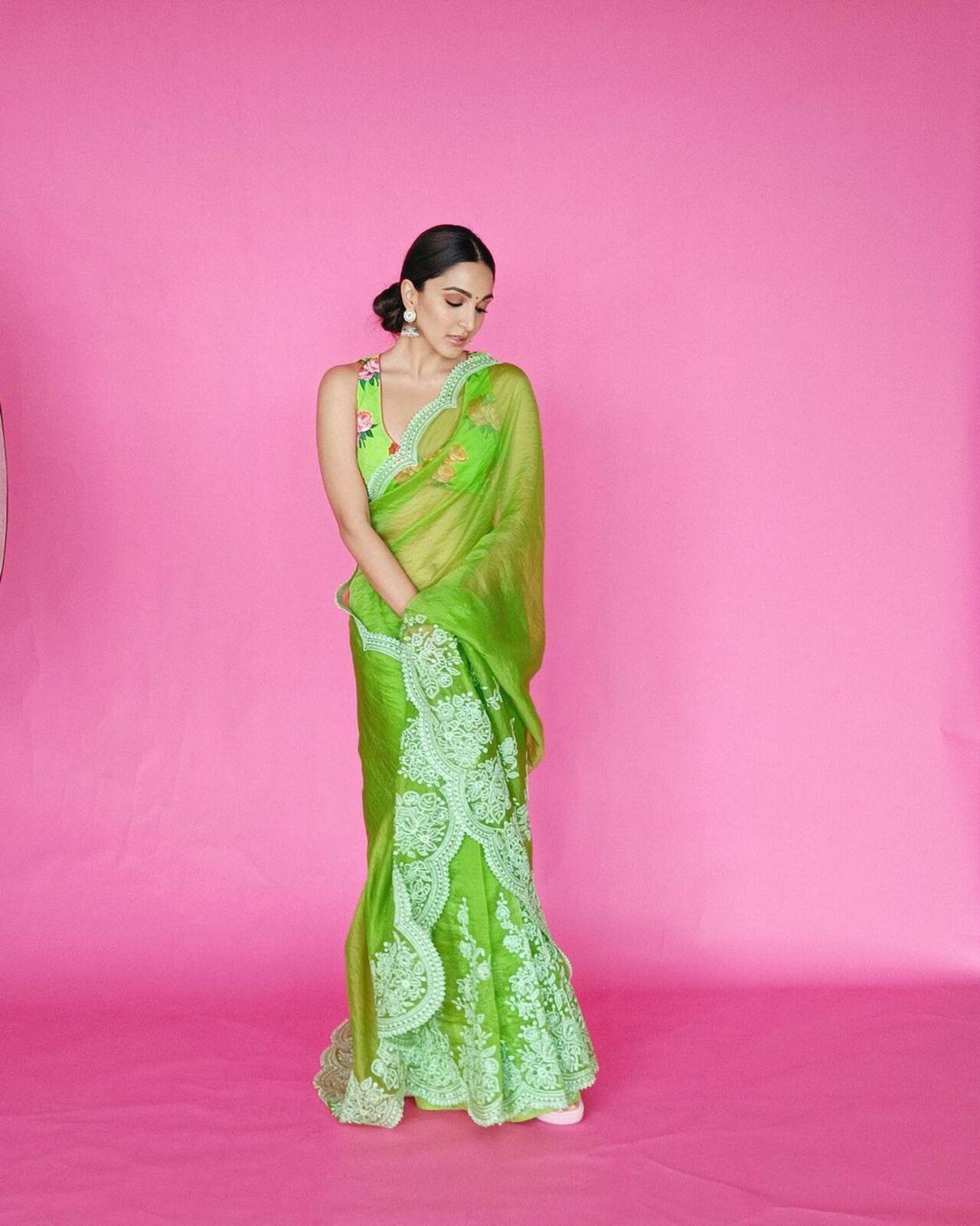 Kiara Advani wore a beautiful green saree with white embroidery on it. The actress paired her saree with a floral strappy blouse