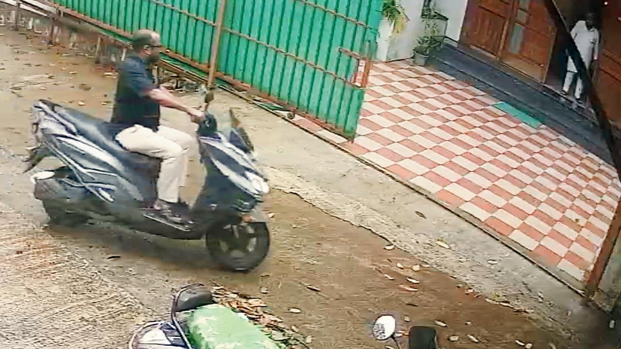CCTV grab of the servant Satish Rao entering the house  