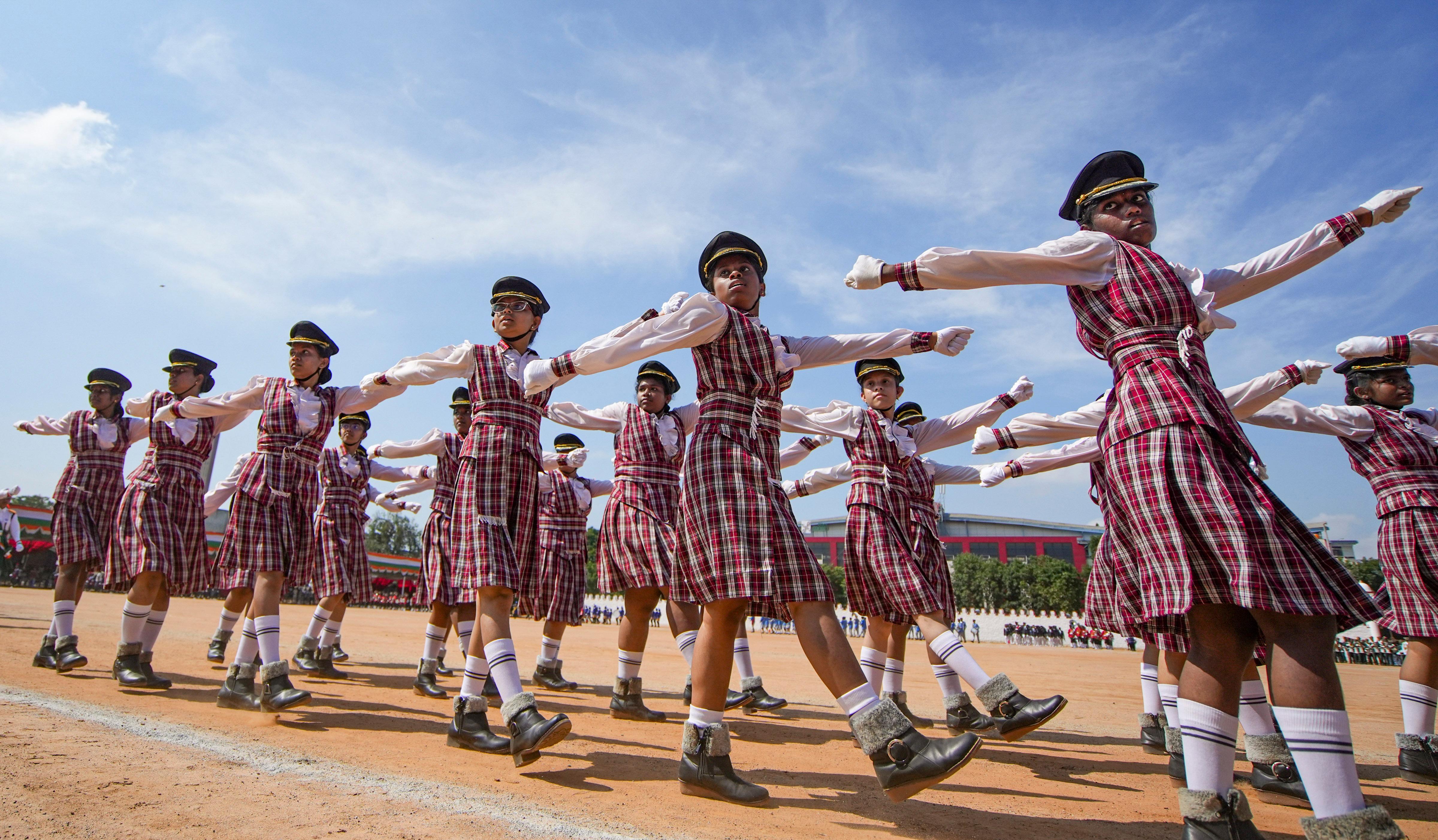 School students march during full dress rehearsal for the 78th Independence Day celebrations, at Manekshaw Parade Ground, in Bengaluru, on Tuesday, 