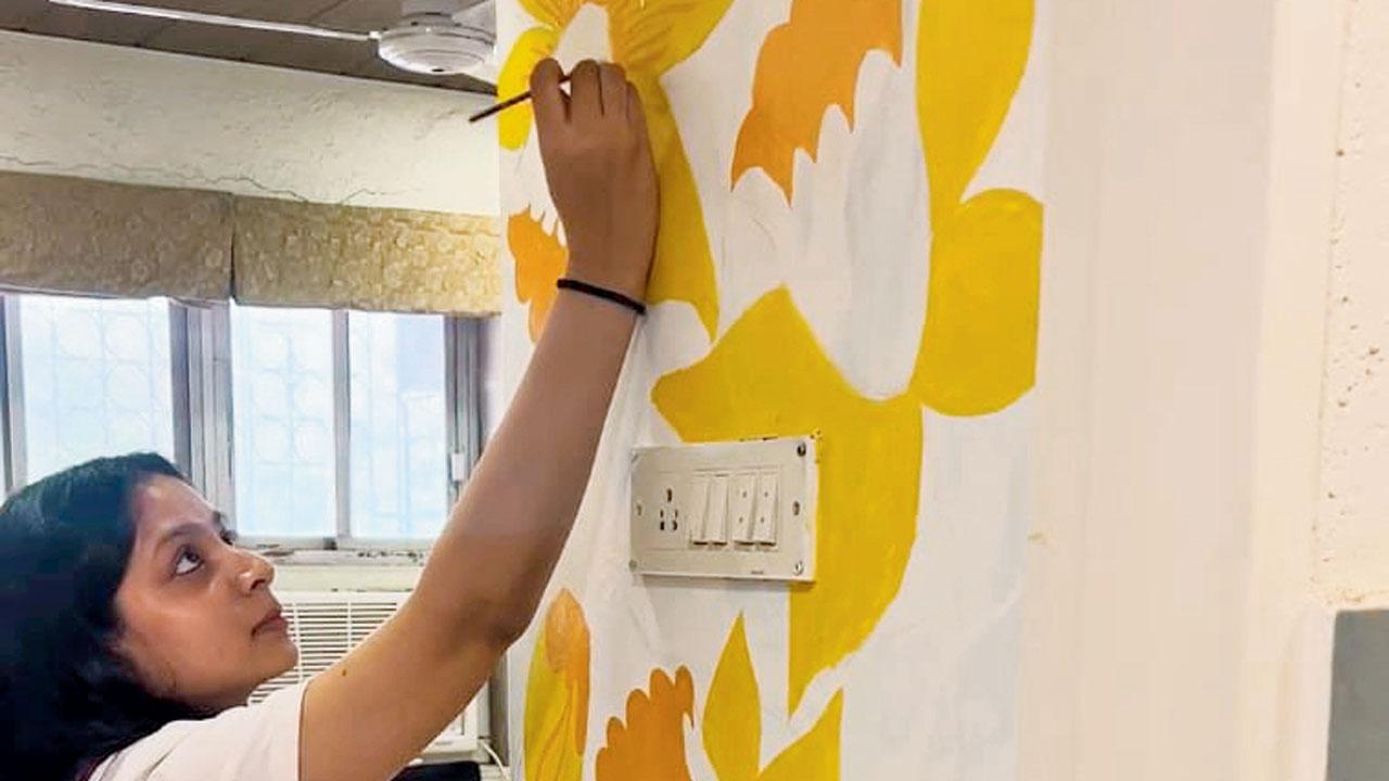 Participants paint on the interiors of the art space
