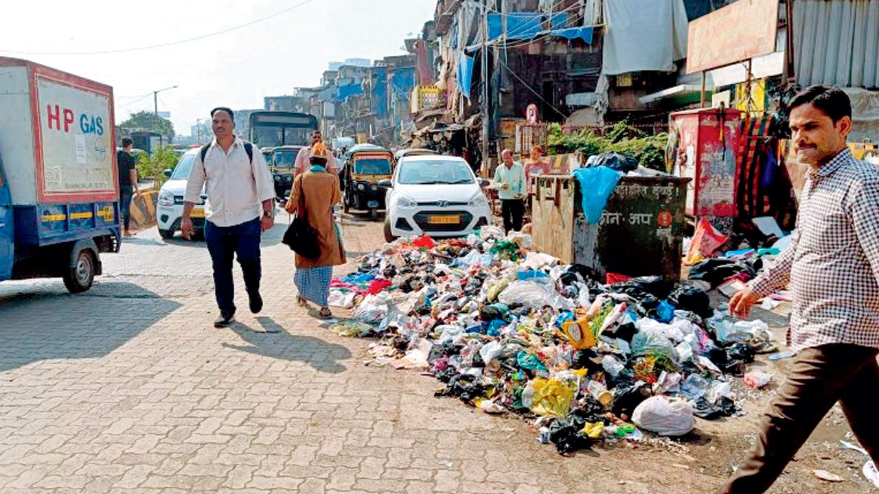 Garbage piles make for unsanitary walking conditions in Bandra