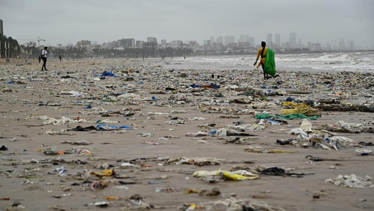 In Photos: BMC workers clean garbage that washed ashore Mumbai's Juhu beach