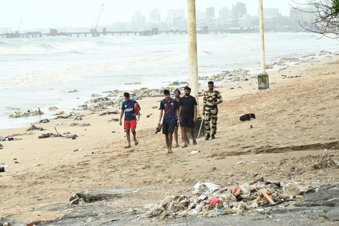 In Photos: Lifeguards and police officials clear Juhu Beach ahead of high tide