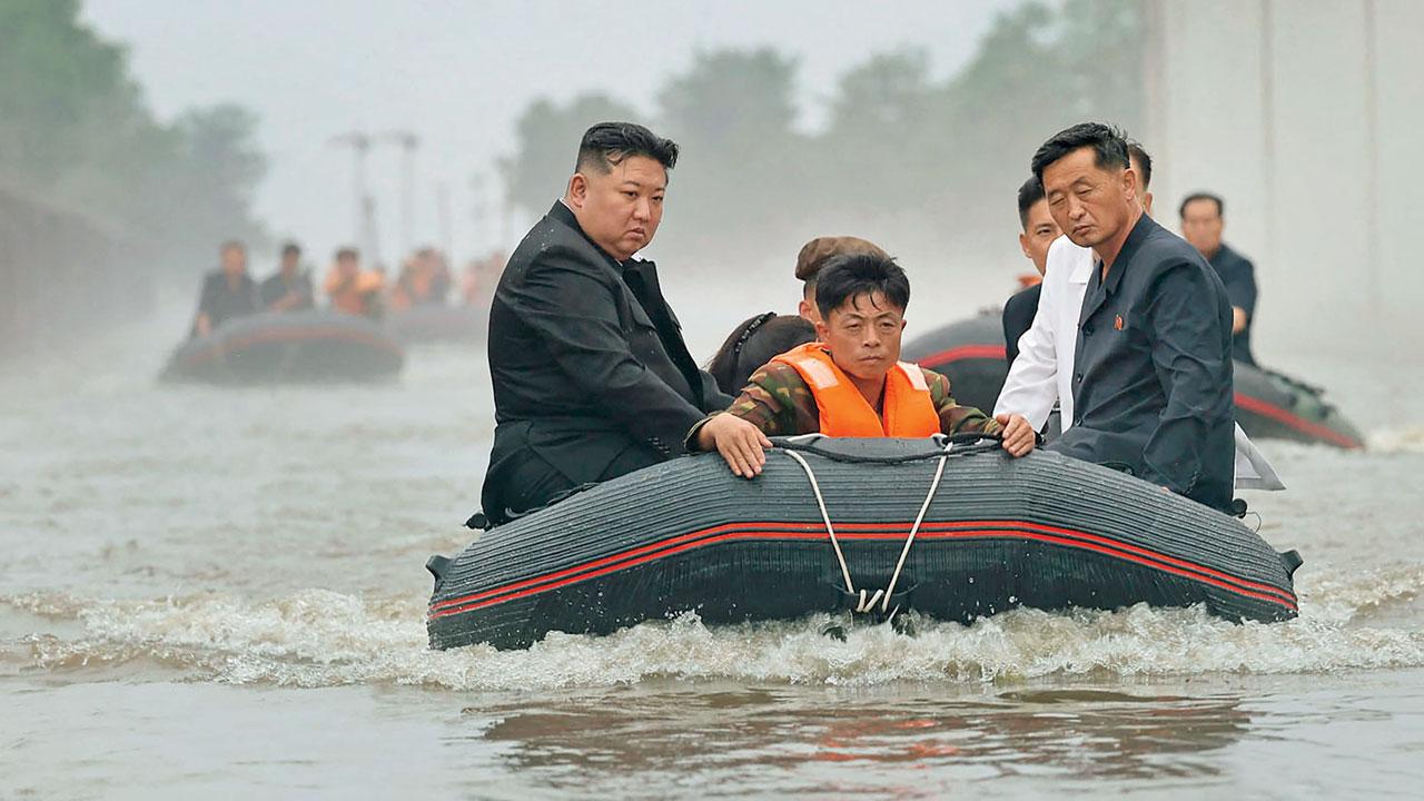 Kim Jong Un riding in a dinghy through flood waters