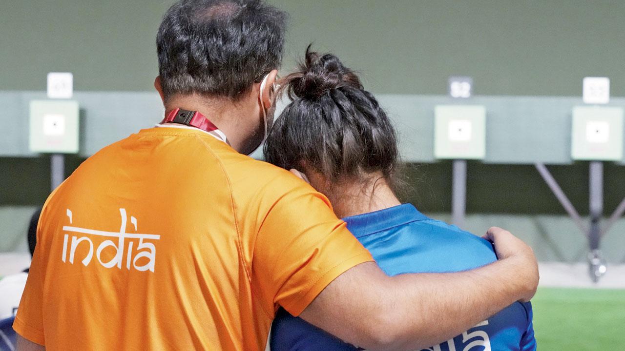 Coach Ronak Pandit (left) with Bhaker after she failed to qualify for the finals of the 10m Air Pistol at the Olympics Games 2021 in Tokyo