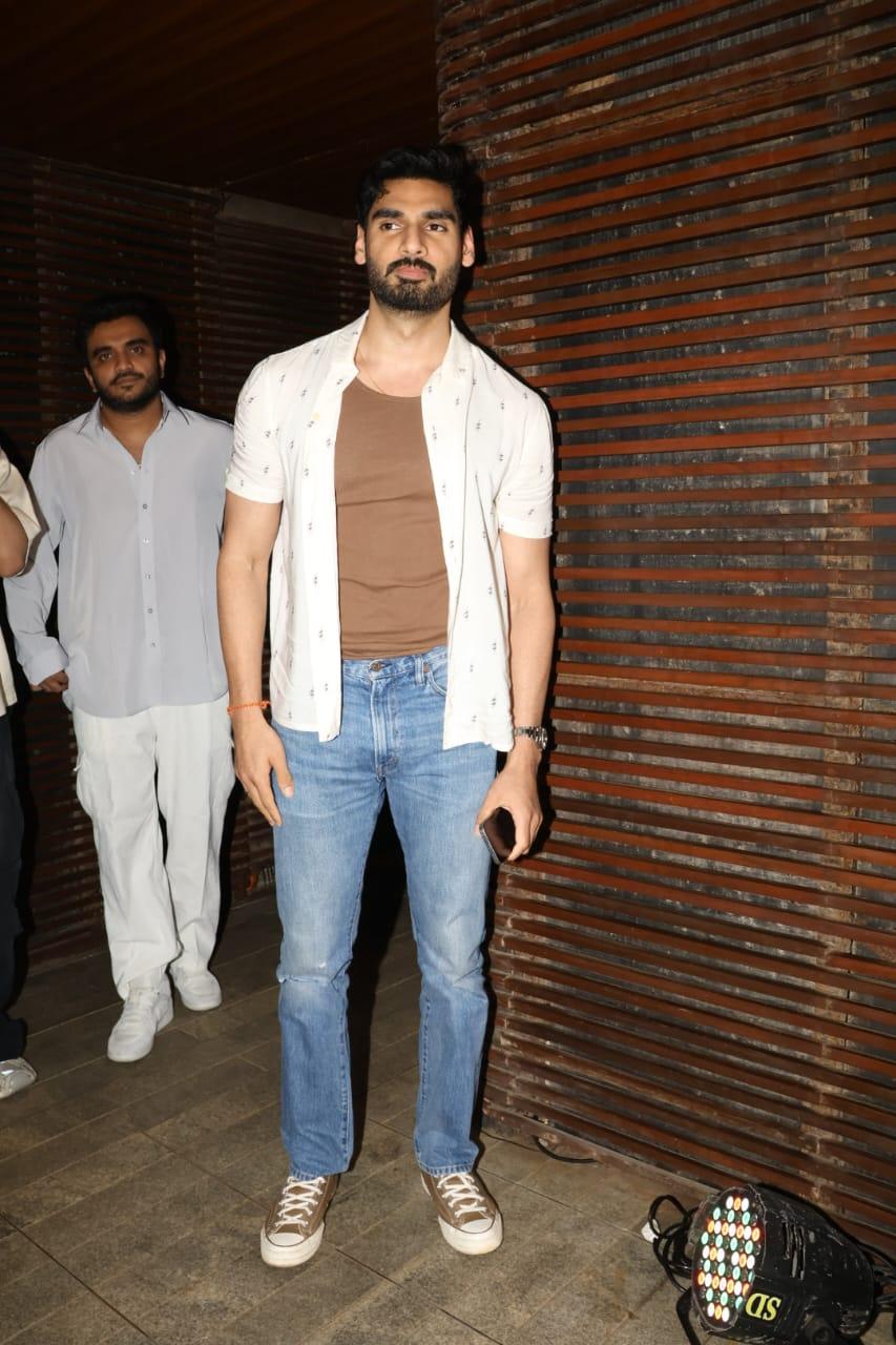Ahan Shetty looked incredibly handsome in beige T-shirt paired with blue jeans and white shirt