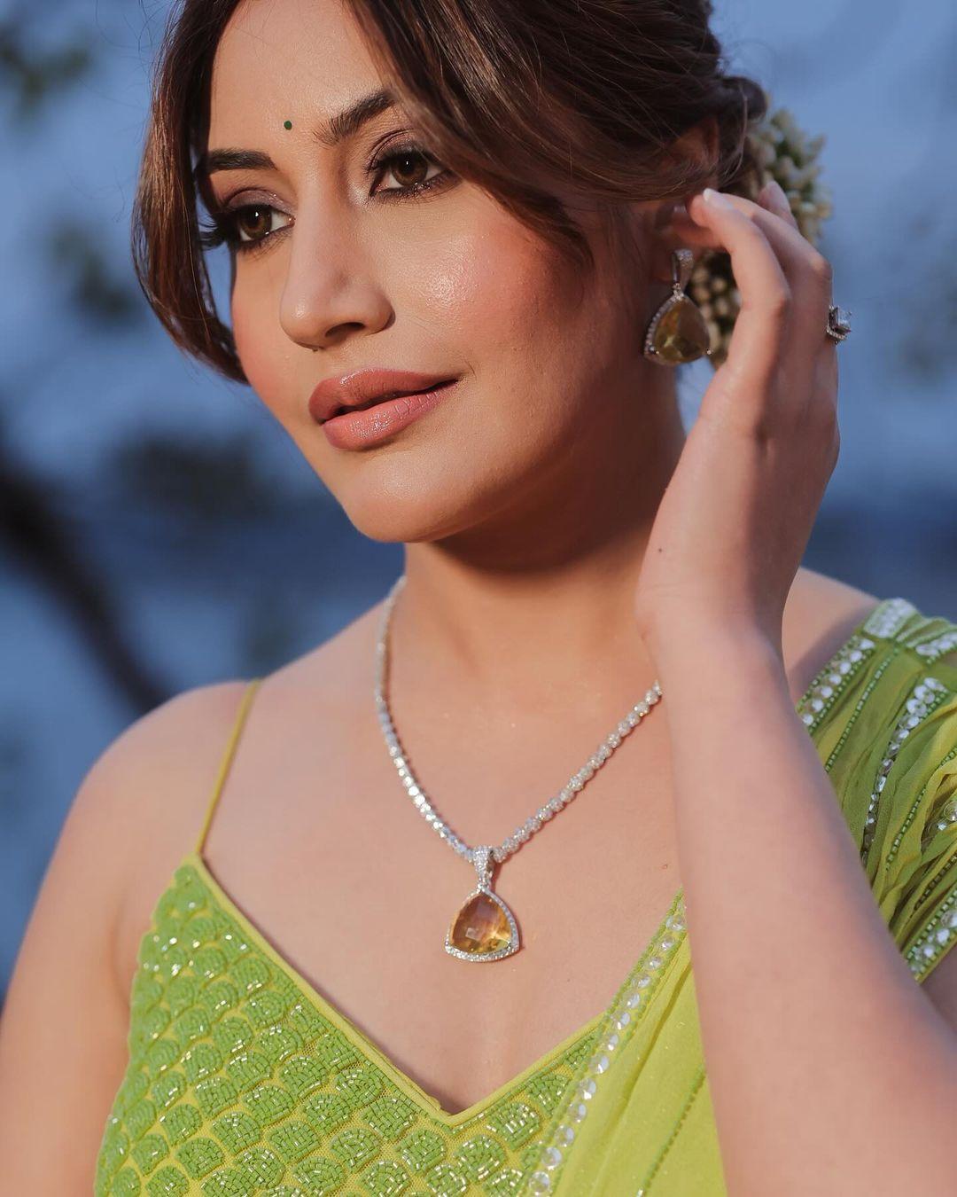 She tied her hair back in a bun decorated with a beautiful gajra and added simple jewellery to enhance her look
