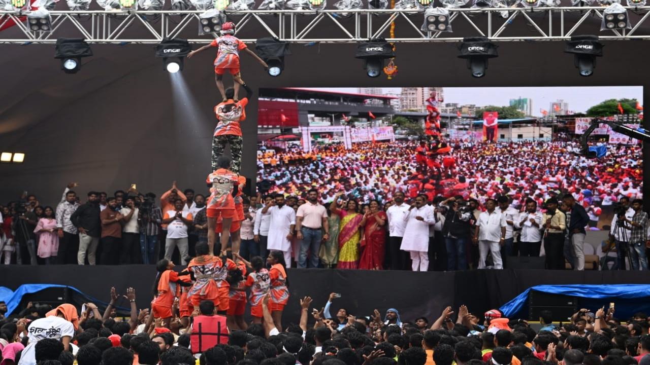 A pathak of girls makes a pyramid way to reach the Handi at an event in Borivali