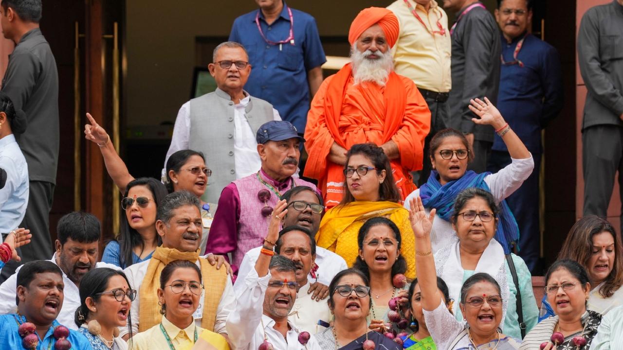 MPs from the Trinamool Congress (TMC), Rashtriya Janata Dal (RJD), Nationalist Congress Party (NCP) - Sharadchandra Pawar, and Shiv Sena (UBT) protested on the steps leading to the Makar Dwar of Parliament during the Monsoon Session on Thursday 
