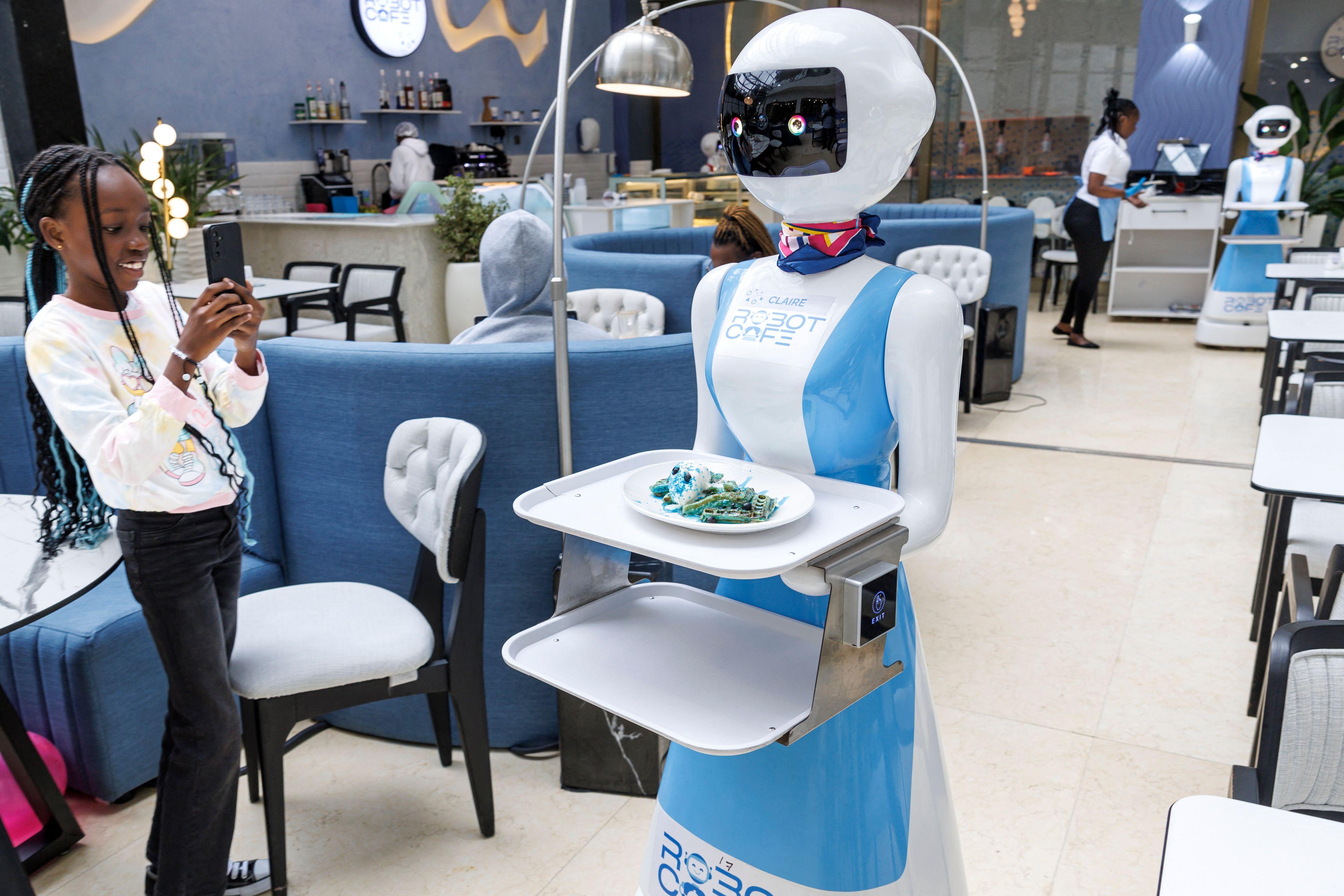 In Photos: Have you ever been welcomed at a cafe by a robot?