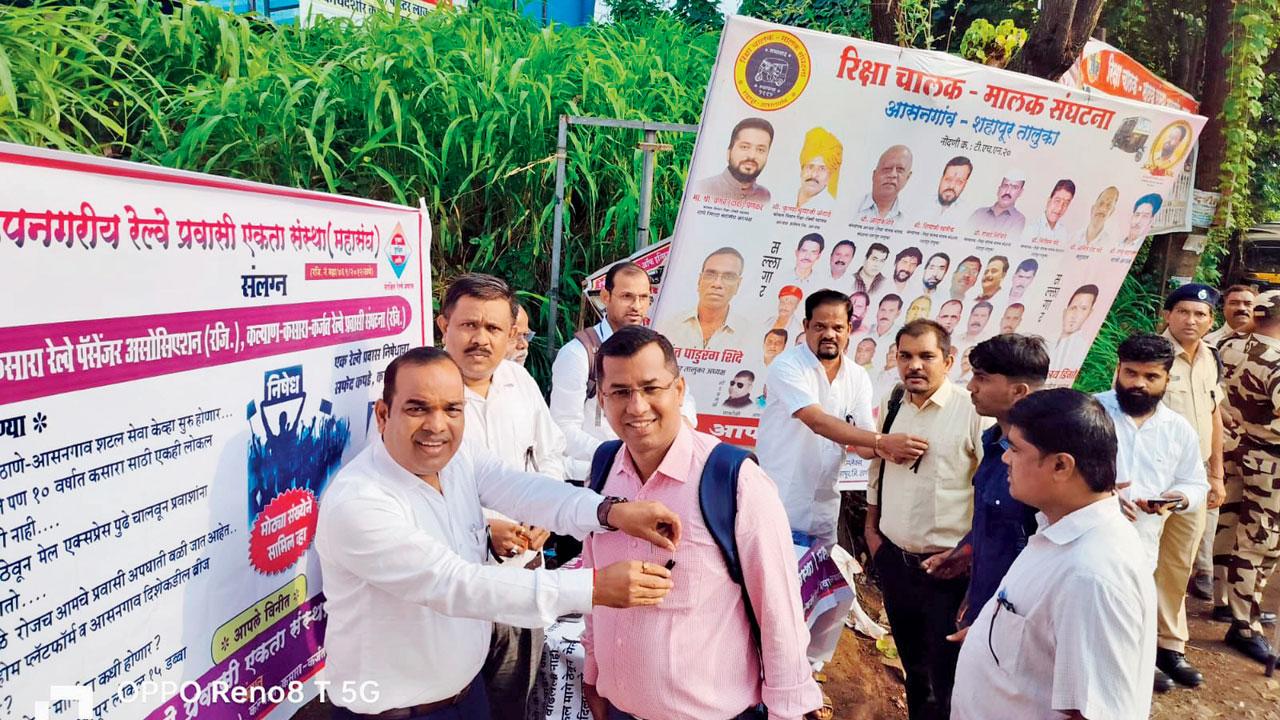Protesting commuters near Asangaon railway station
