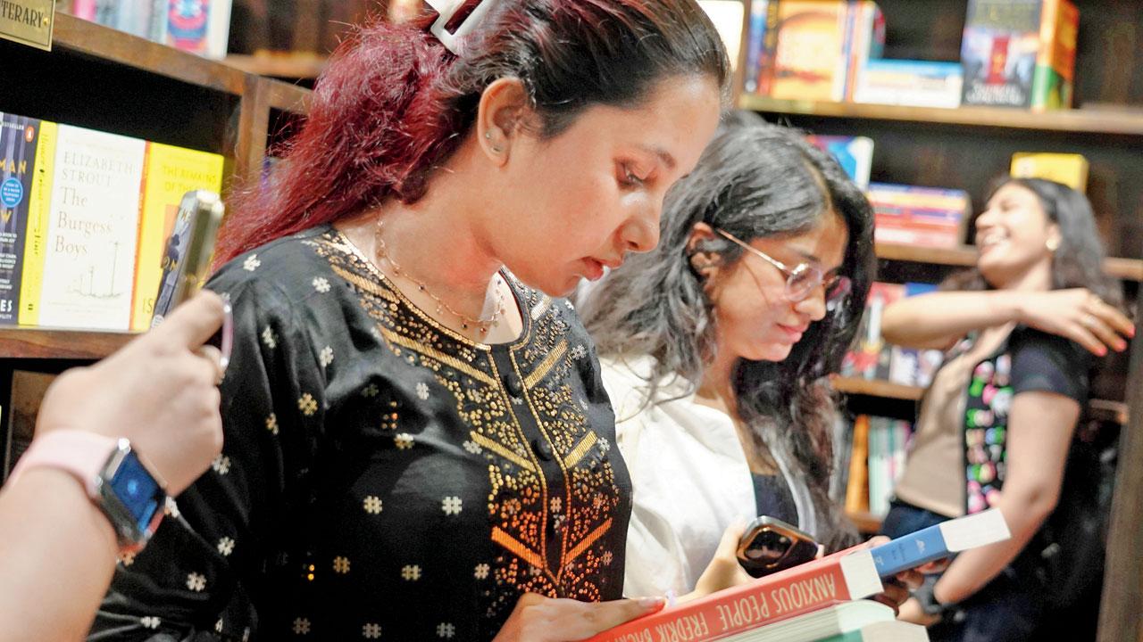 Readers check out new titles at Fictionary, which opened on Saturday at 32nd Road, Bandra West. PICS/ADITI HARALKAR