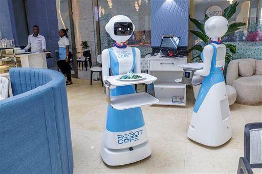 Working alongside human staff, the robots are programmed with artificial intelligence and controlled remotely to provide services that include calling out welcomes to approaching patrons, serving up non-spillable orders and even belting out 'happy birthday' music 