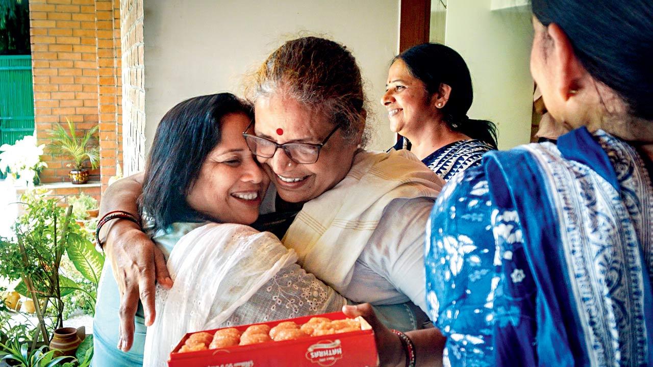 Sisodia’s family members celebrate after SC grants him bail. Pic/PTI
