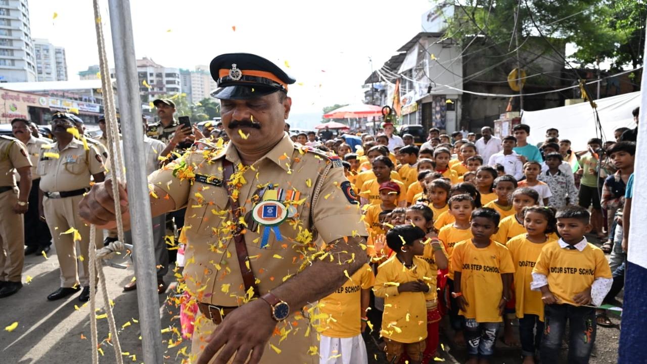 The present and the future: School children participate in a flag-hoisting ceremony with the police in Goregaon.