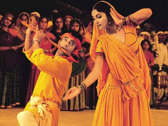 Radha Kaise Na Jale  
This classic song from Lagaan, portrays Radha's jealousy as she questions how she could not feel envious when Krishna flirts with other gopis. The song captures Radha’s playful but deep affection for Krishna. The song features Aamir Khan and Gracy Singh