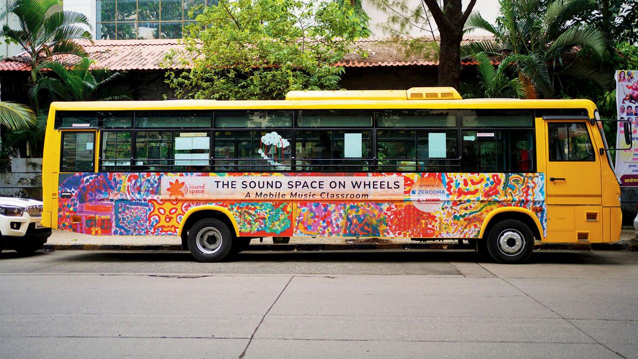 Girls who have begun to wait for The Sound Space on Wheels bus to arrive in their neighbourhood