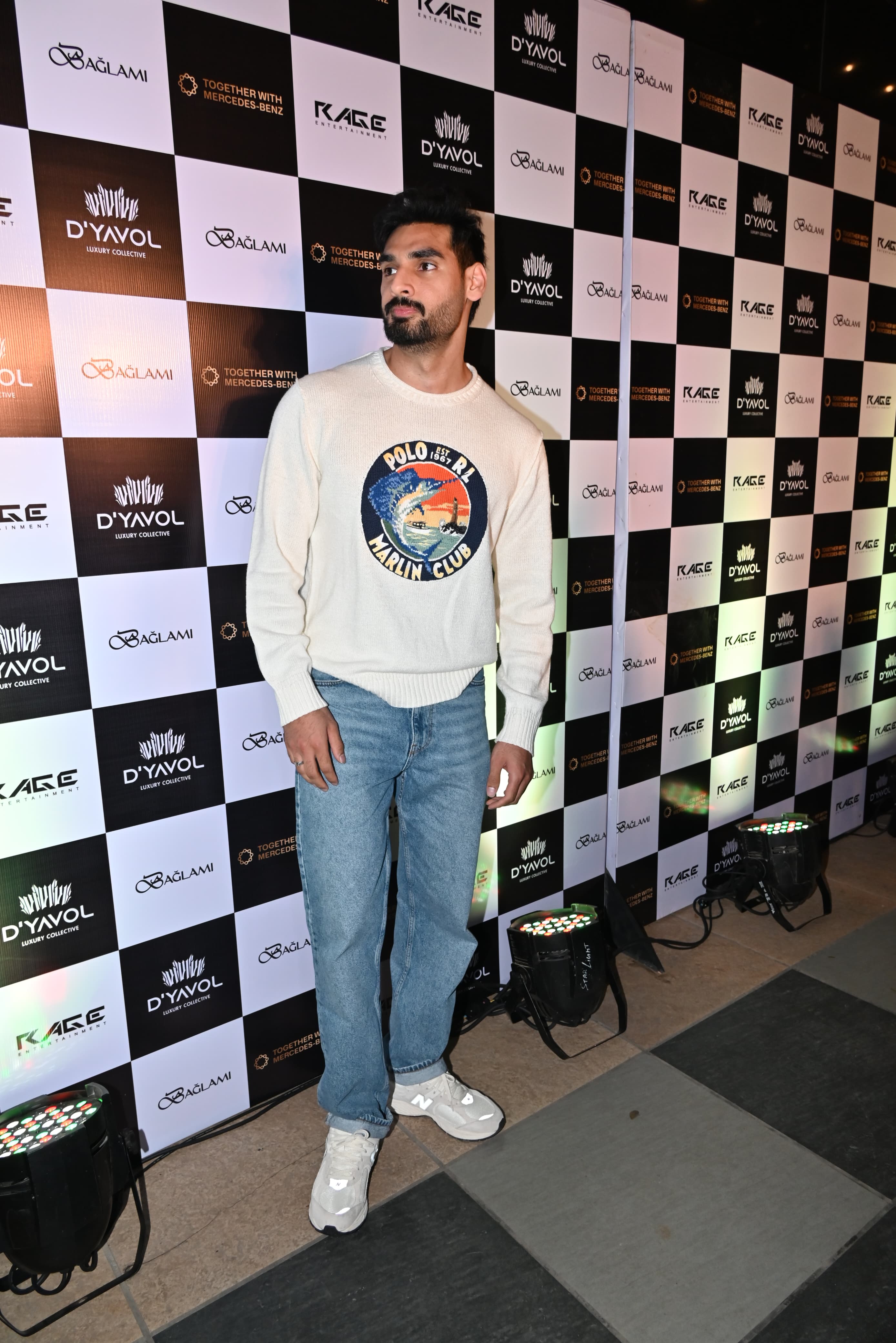 Ahan Shetty looked dapper in a white hoodie and blue jeans