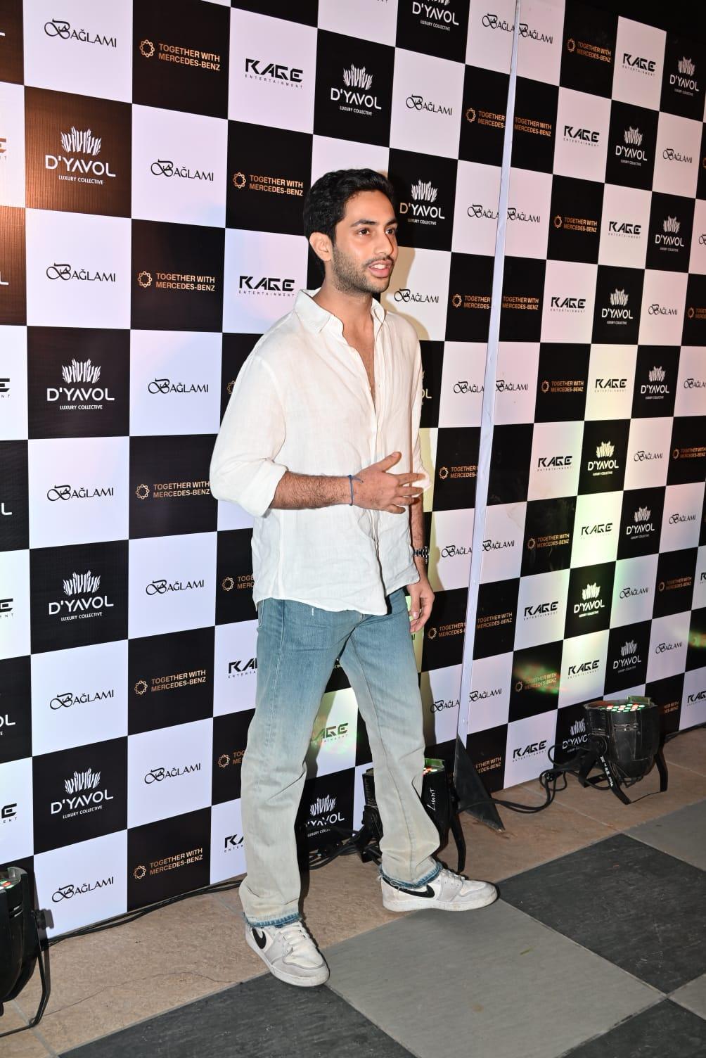 Agastya Nanda wore a white shirt and paired it with blue jeans as he attended the event
