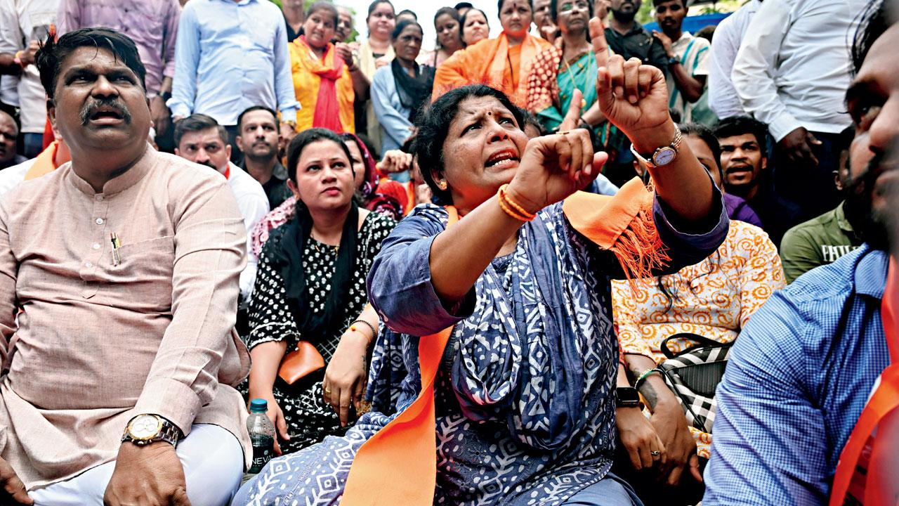Shiv Sena (UBT) deputy leader Sushma Andhare sits on a dharna at Badlapur police station on Wednesday. Pic/Sayyed Sameer Abedi