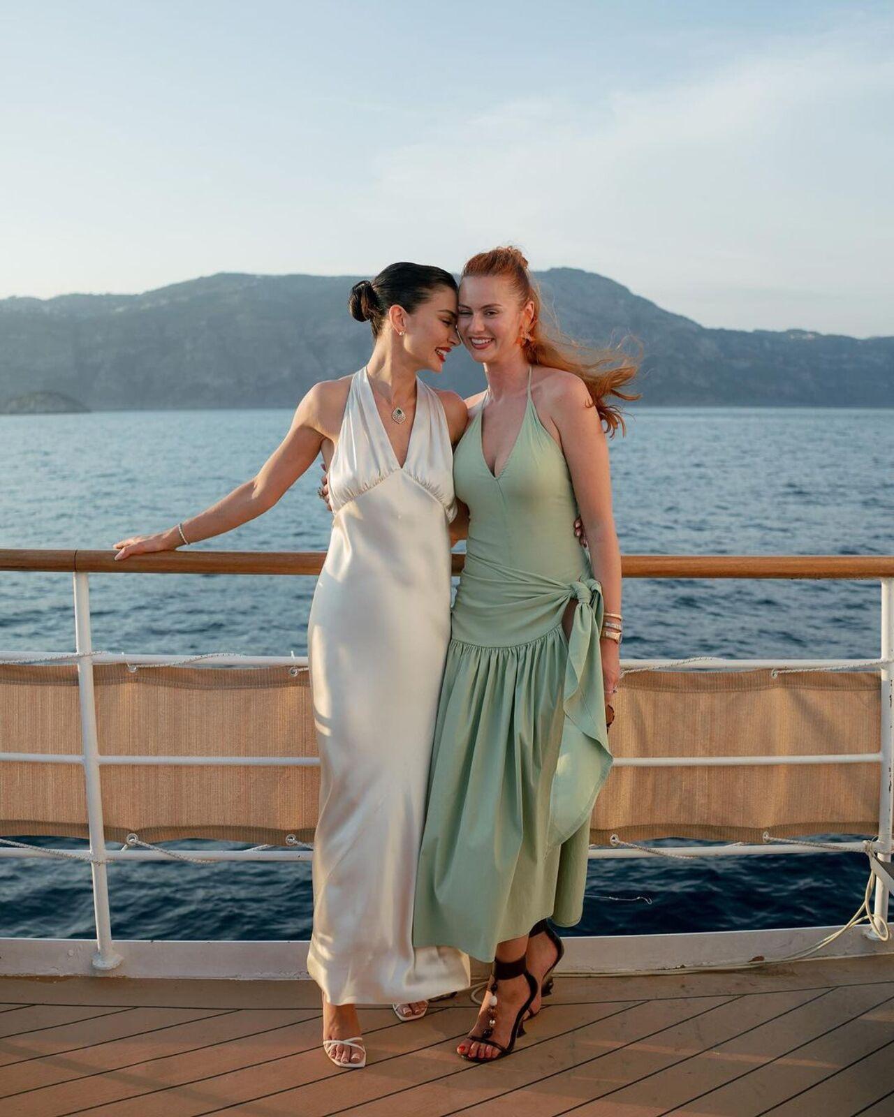 For the sundowner, she changed into a Saint Laurent satin halter-neck dress. 