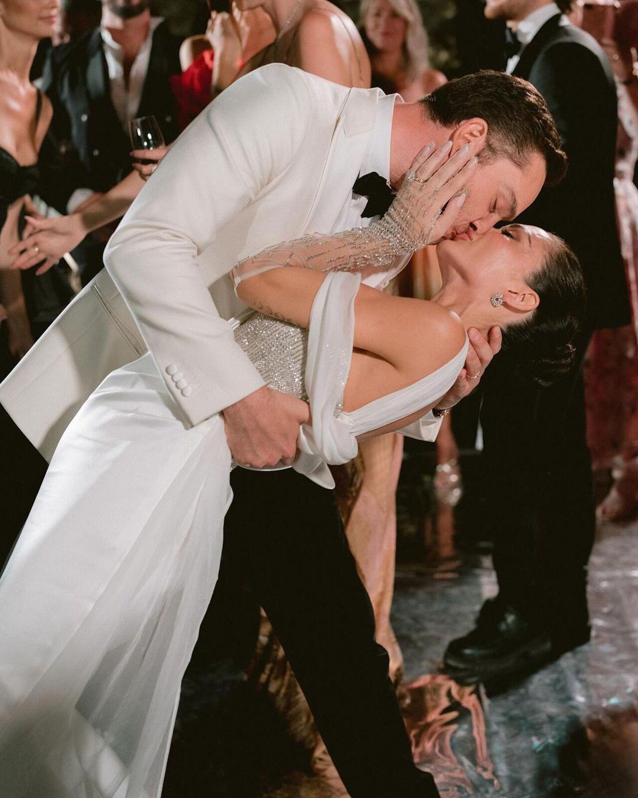 For the reception, Amy wore a bespoke Pronovias silk and crystals gown handcrafted in Barcelona. 