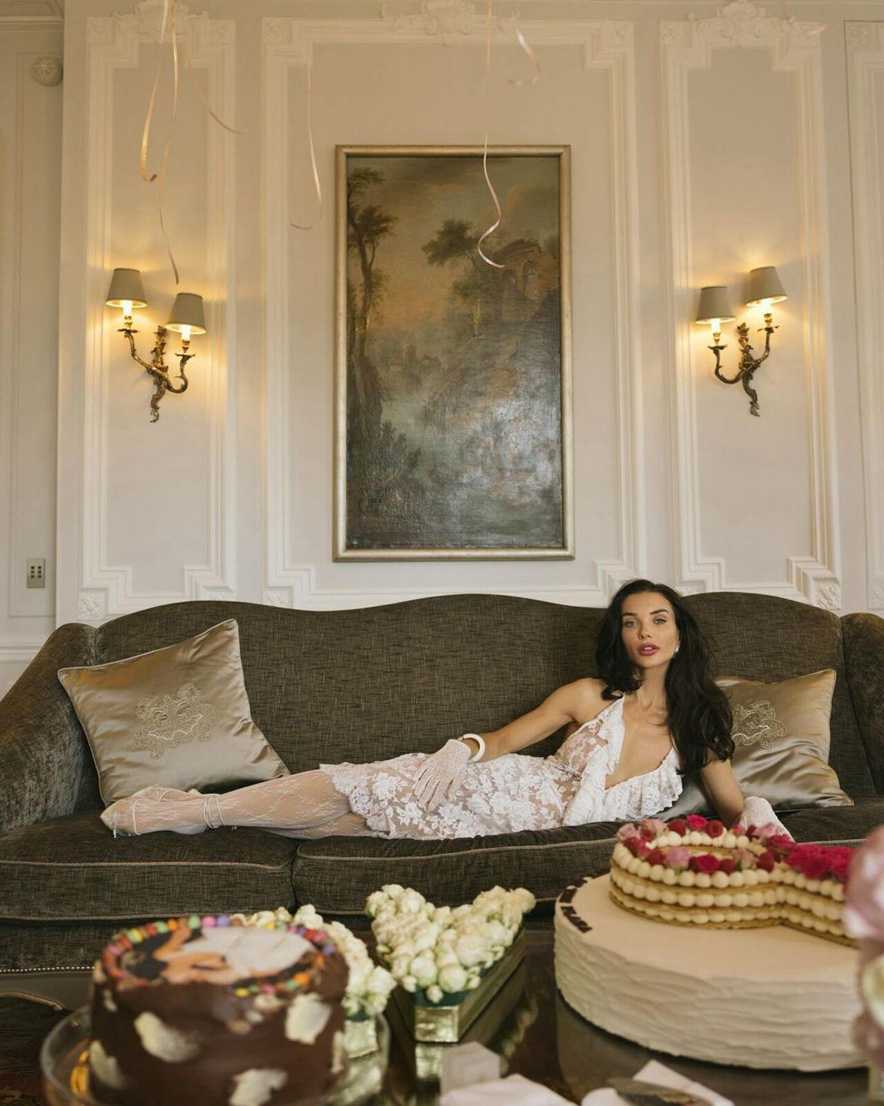 She stayed at the Hotel Plaza Athenee and flaunted a sheer lace dress by Shushu/Tong.