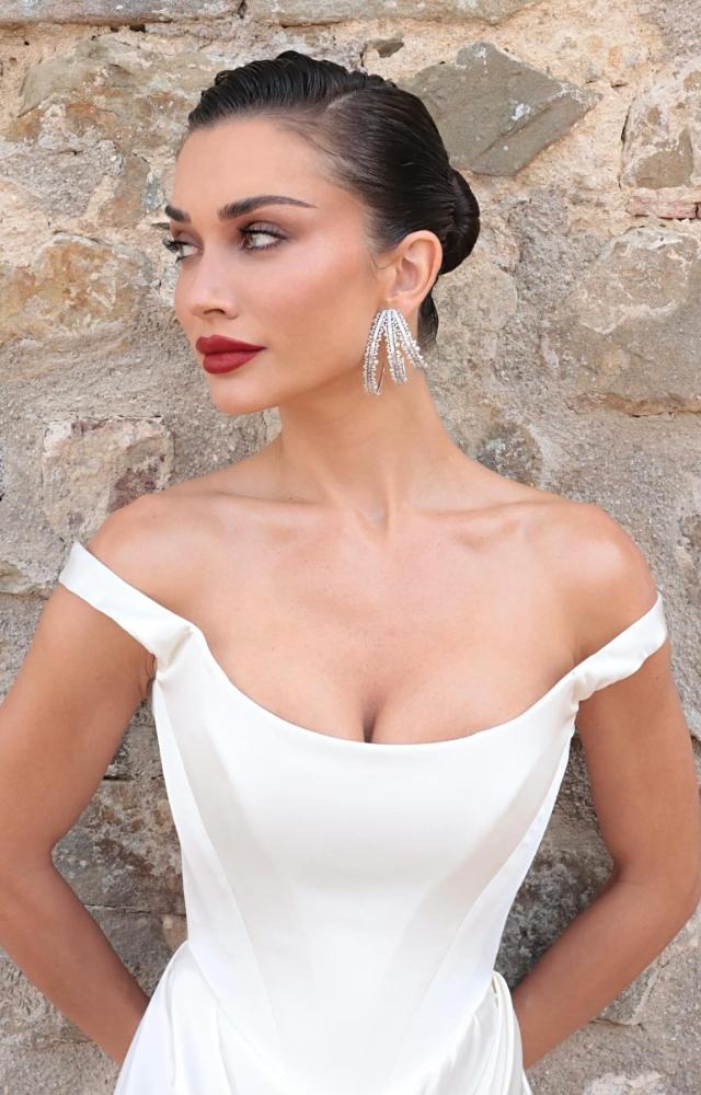 For her grand wedding, the Singh Is Bliing actress chose an extravagant, pristine white gown.