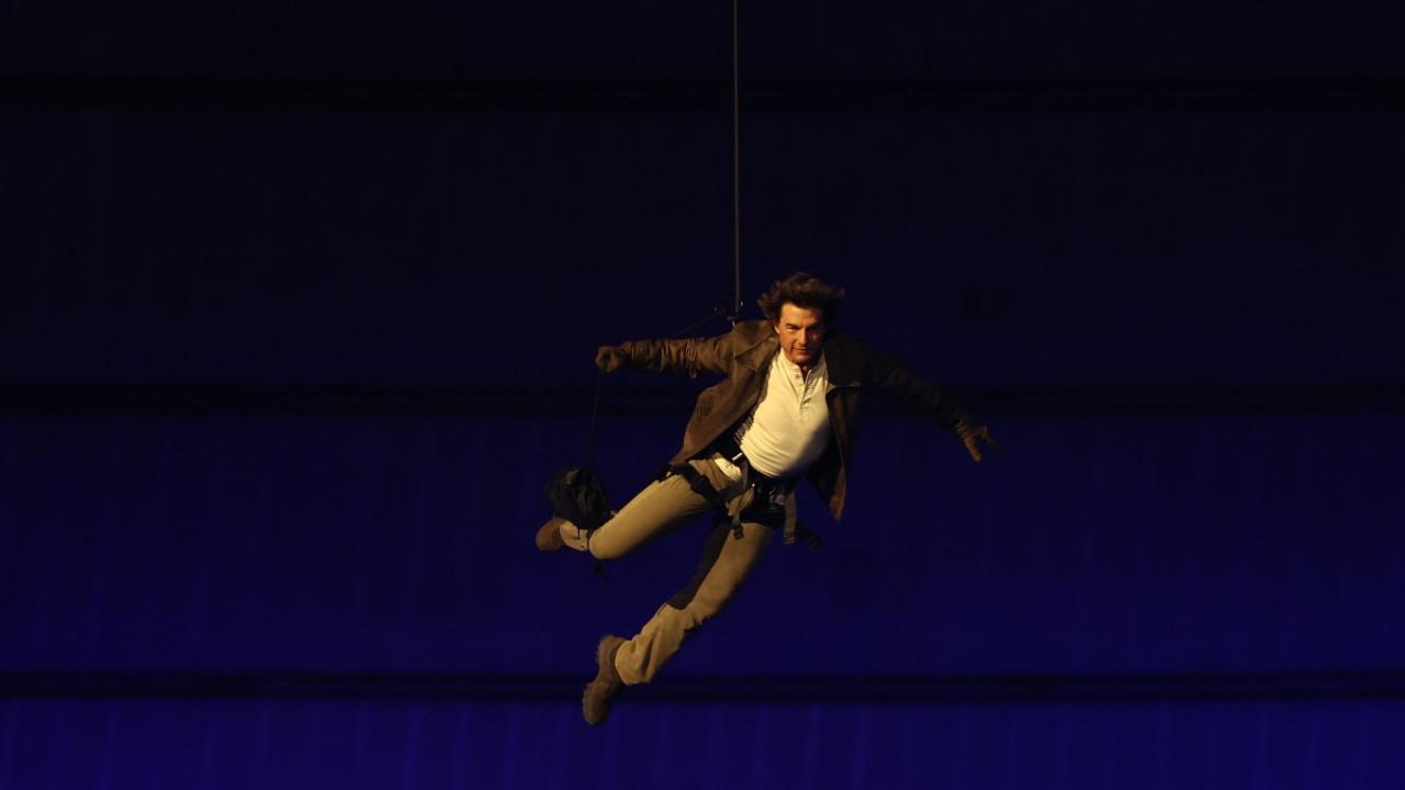 Hollywood star Tom Cruise abseiled from the roof of the Stade de France as Paris said farewell to an Olympics hailed as one of the most successful in history. Cruise descended on a wire in front of 71,500 spectators, grabbed the Olympic flag and jumped on a motorbike, to the delight of athletes and fans. In a preview of what the world can expect when the Games head to Los Angeles in 2028, the 