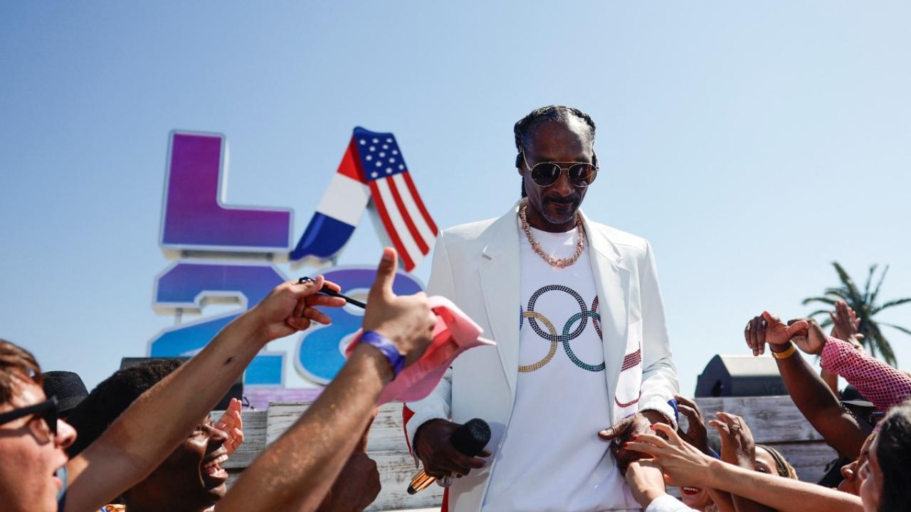 Los Angeles band Red Hot Chili Peppers, singer Billie Eilish and rappers Snoop Dogg and Dr Dre then performed a mini-concert during the Handover ceremony on a beach framed by the azure waters of the Pacific Ocean.