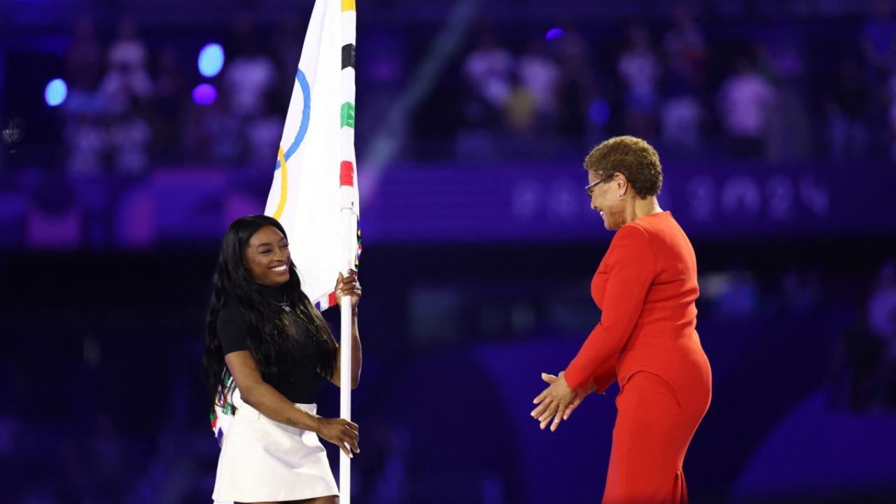 The closing spectacle marked the beginning of the four-year countdown to the LA Games, and American gymnastics icon Simone Biles joined Los Angeles mayor Karen Bass as the Olympic flag was formally handed over.