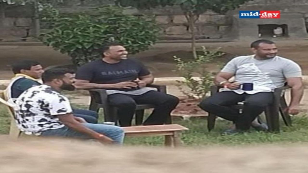 Photo of murder-accused Kannada actor Darshan, holding cigarette, sitting in open space in jail, emerges