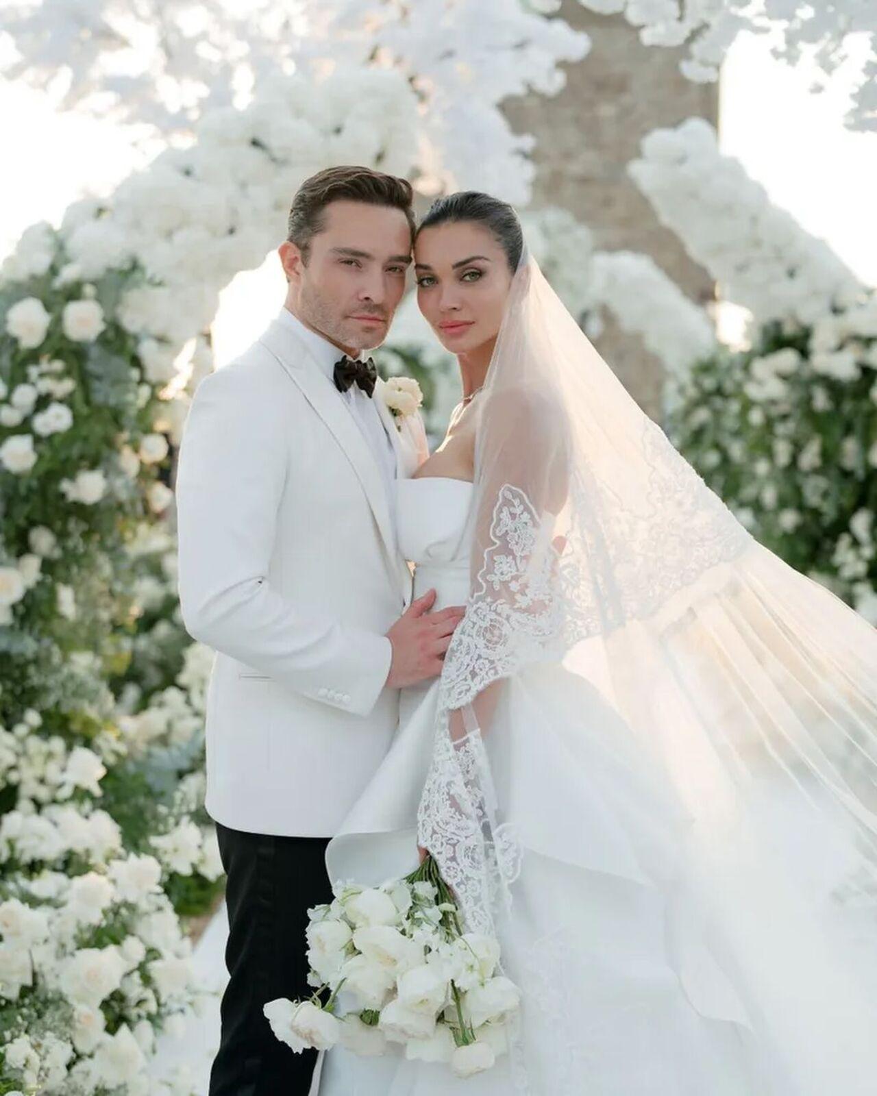 Ed Westwick matched her grace in a white suit