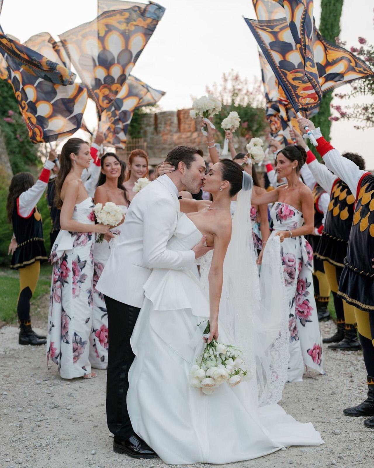 Ed Westwick gives his wife a passionate kiss after their pronounced man and wife