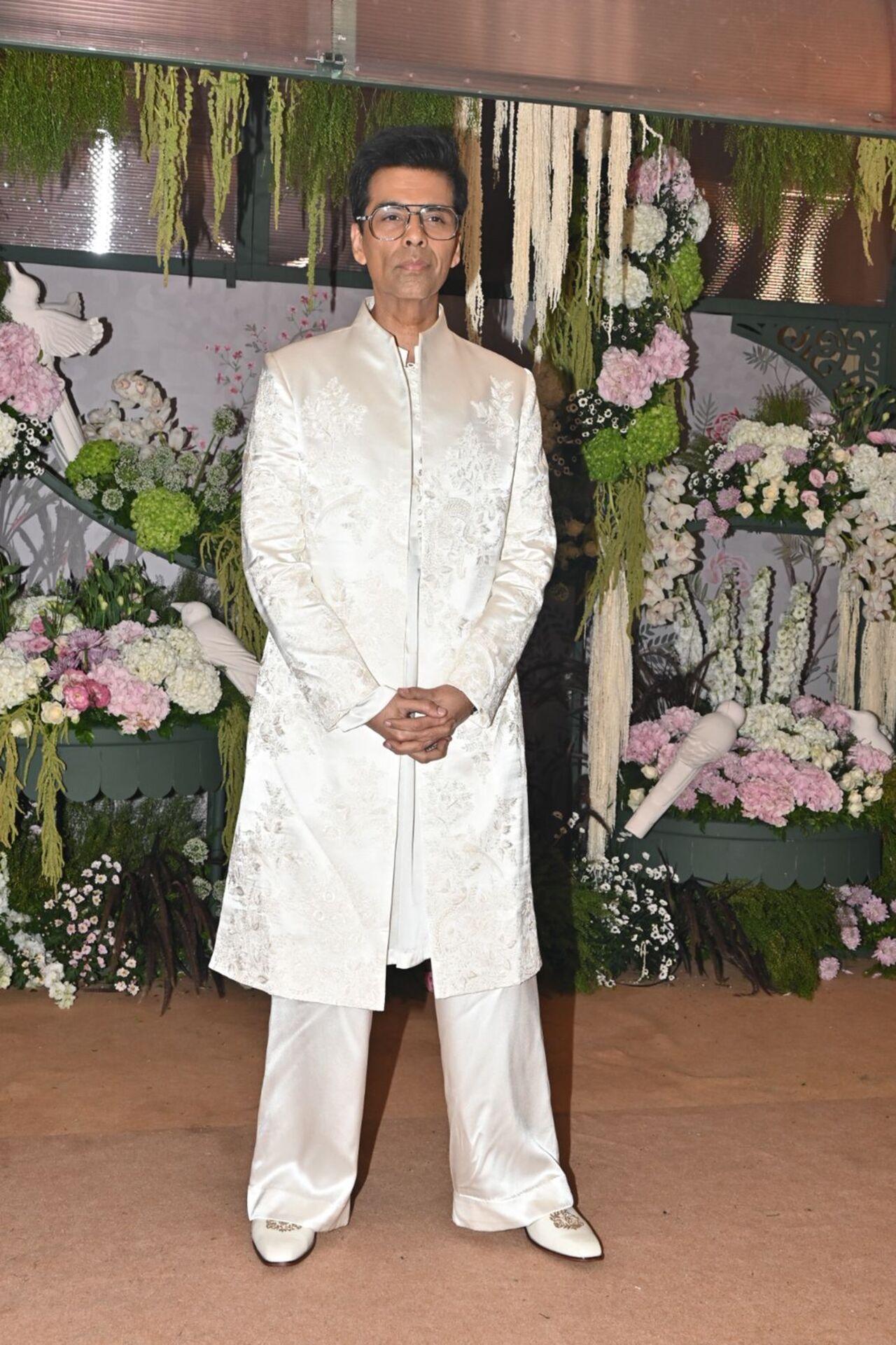 Karan Johar rocked a white sherwani as he made his entry at the engagement party.