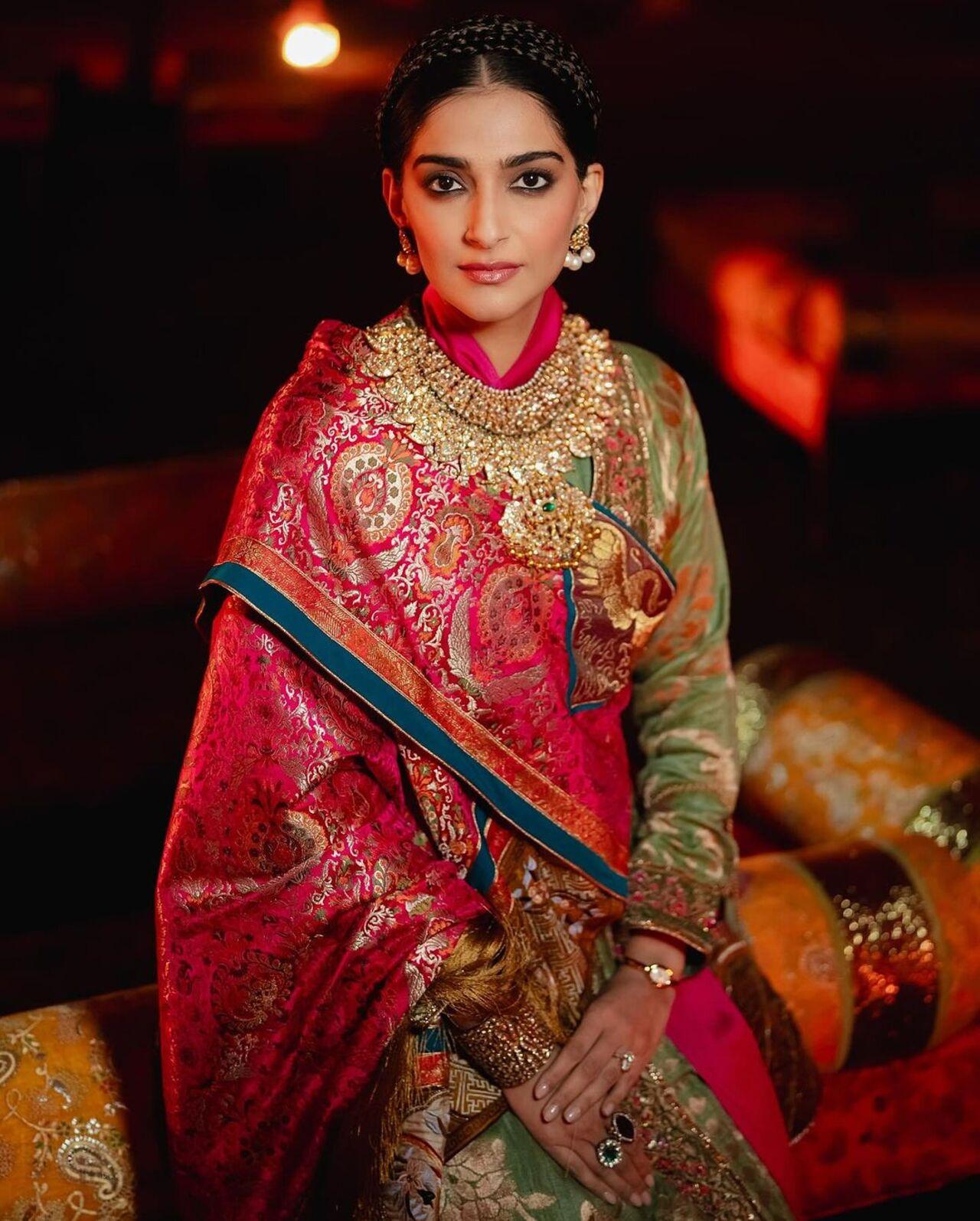Sonam Kapoor wore the traditional attire of Ladakh for the Ambani pre-wedding in Jamnagar. Crafted from silk by artisans of Benaras, this ensemble featured intricate phoenix embroidery symbolizing energy and wisdom, with a crane motif representing peace and prosperity.