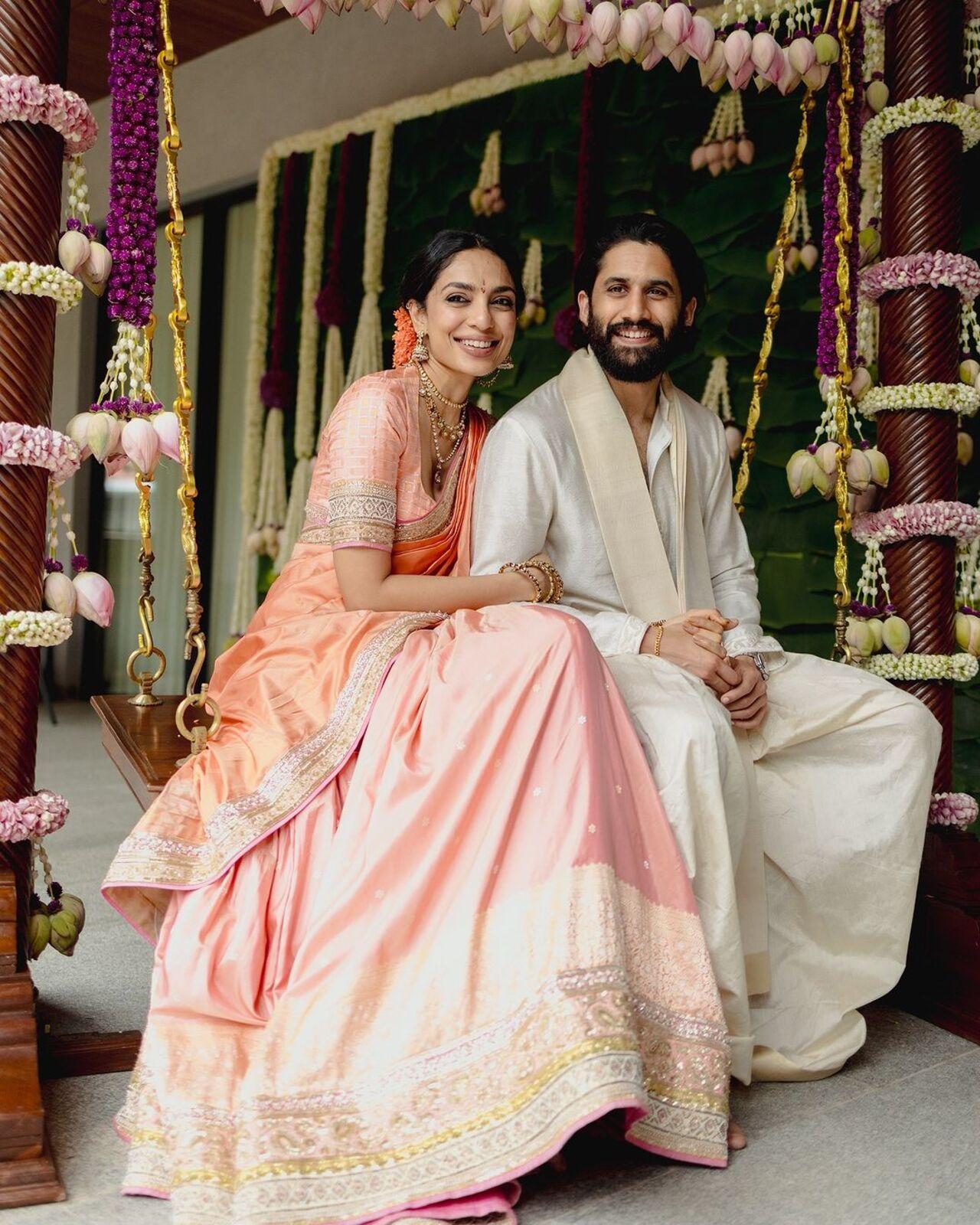 At her engagement, Sobhita Dhulipala wore a golden blush Uppada silk saree by Manish Malhotra. She opted for a hue inspired by the Kanakaambaram, a traditional temple flower worn by Telugu women, and the eternal Padmam (lotus). The silhouette, derived from the paintings of iconic Telugu artist Bapu, echoed the classic half-saree style of young South Indian women.