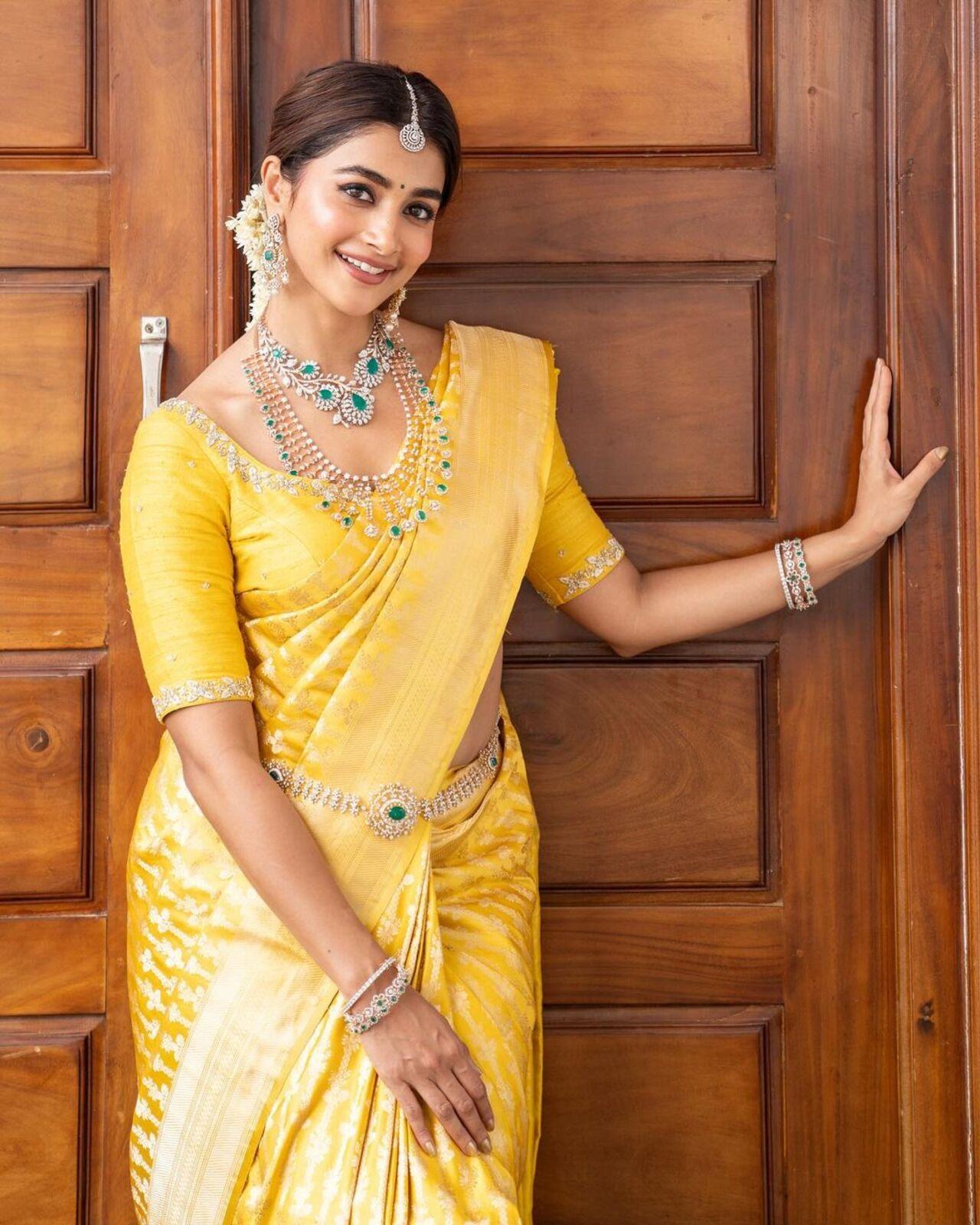 Pooja Hegde transformed into a traditional Mangalorian diva in this yellow saree for a family event. 