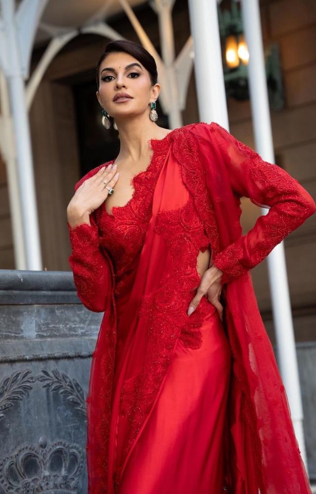 For the India Day Parade in the US, Jacqueline wore a bespoke red saree with a matching floor-length jacket to combat the weather in style. 