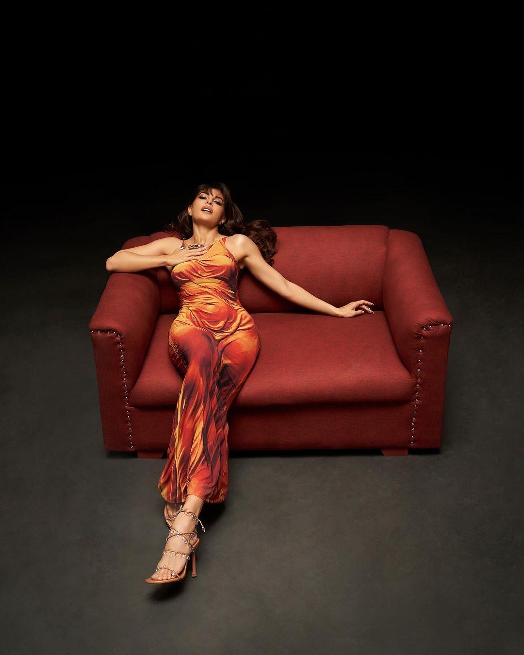 The deep orangy-red colour with yellow accents highlighted her curves perfectly. This stylish gown is the ultimate inspiration for a summer night out with your friends.