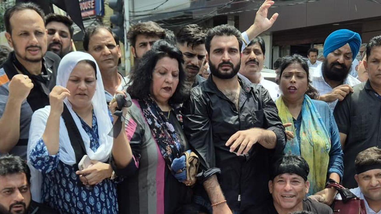 The National Conference condemned the government's actions regarding house arrests, describing them as a blatant suppression of dissent. This highlights the government's ongoing struggle to manage the political unrest in the region while maintaining control over opposition parties and ensuring security during significant anniversaries.