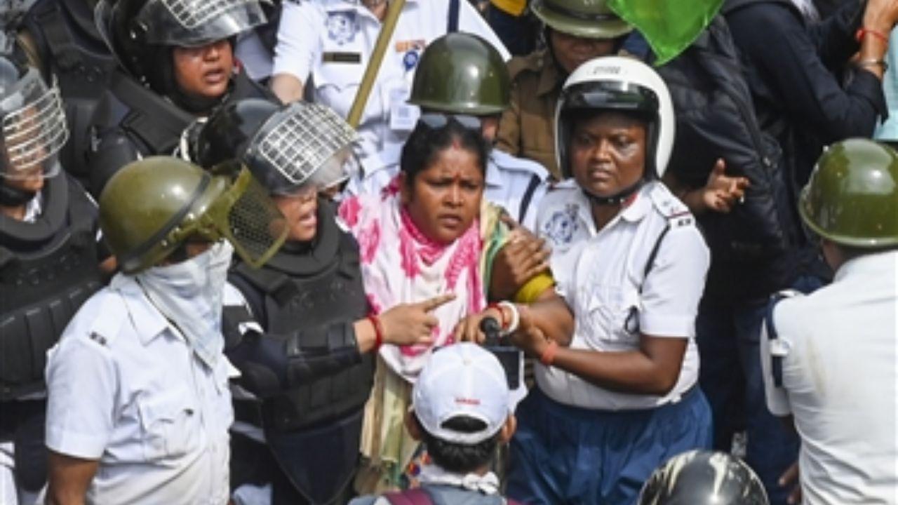 Police resorted to lathi-charge, tear gas, and water cannons to disperse the aggressive crowd attempting to reach the West Bengal state secretariat, Nabanna. The clashes resulted in injuries to 29 police personnel.