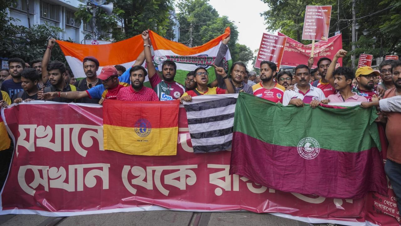 Donning their respective club colours, football fans carried flags of Mohun Bagan, East Bengal and Mohammedan and held together a giant banner 'Justice for R G Kar' while marching in procession from College Square to Esplanade in central Kolkata