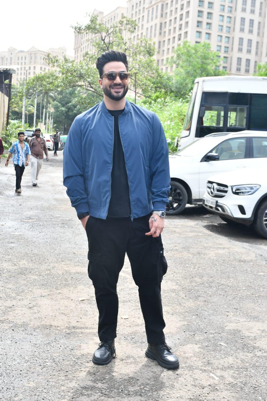 Aly Goni looked handsome in black pant and shirt paired with blue jacket