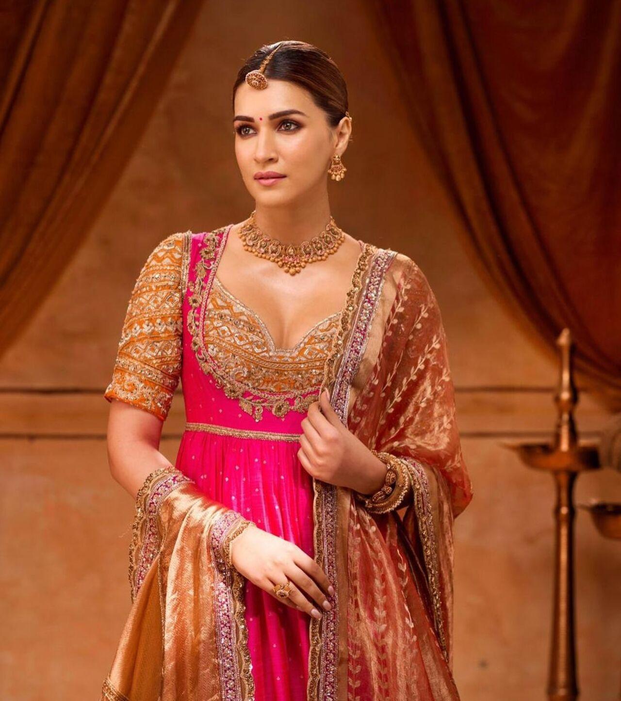 Kriti Sanon recently wore an archival four-piece ensemble comprising of a Rani pink angarakha kurta adorned with pure zardosi embroidery, paired with an intricate Aboli zari blouse, worn over a handloom Awadhi Izaar pants with a woven tissue dupatta. 